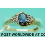 A 9ct gold ring set with a Ceylon sapphire and diamonds (size P/Q)