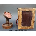 A carriage clock carrying case, together with a turned wooden pocket watch stand,