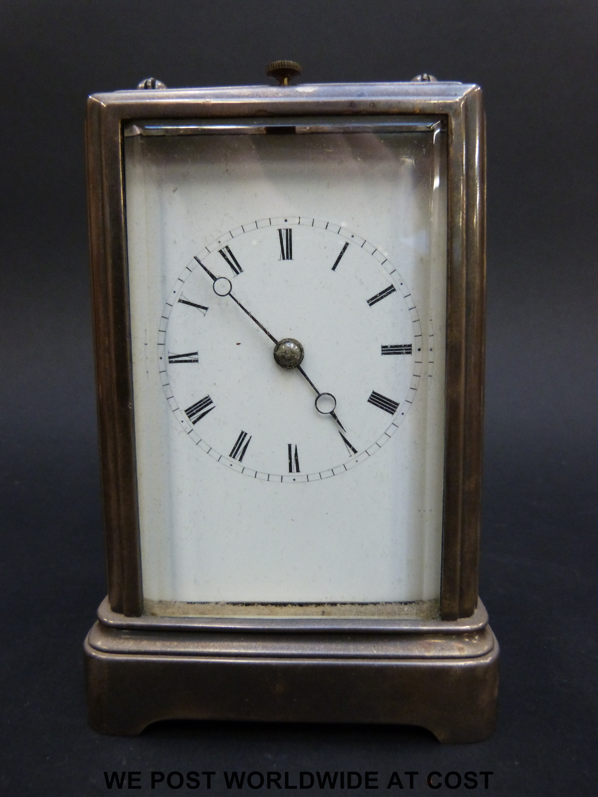 A late 19thC carriage clock with repeating mechanism striking on a bell,