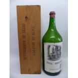 An empty Balthazar sized bottle of Cotes du Marmandais complete with wooden case