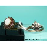 A 9ct gold ring set with diamonds (size J) and a 9ct gold ring set with an opal and garnets (size