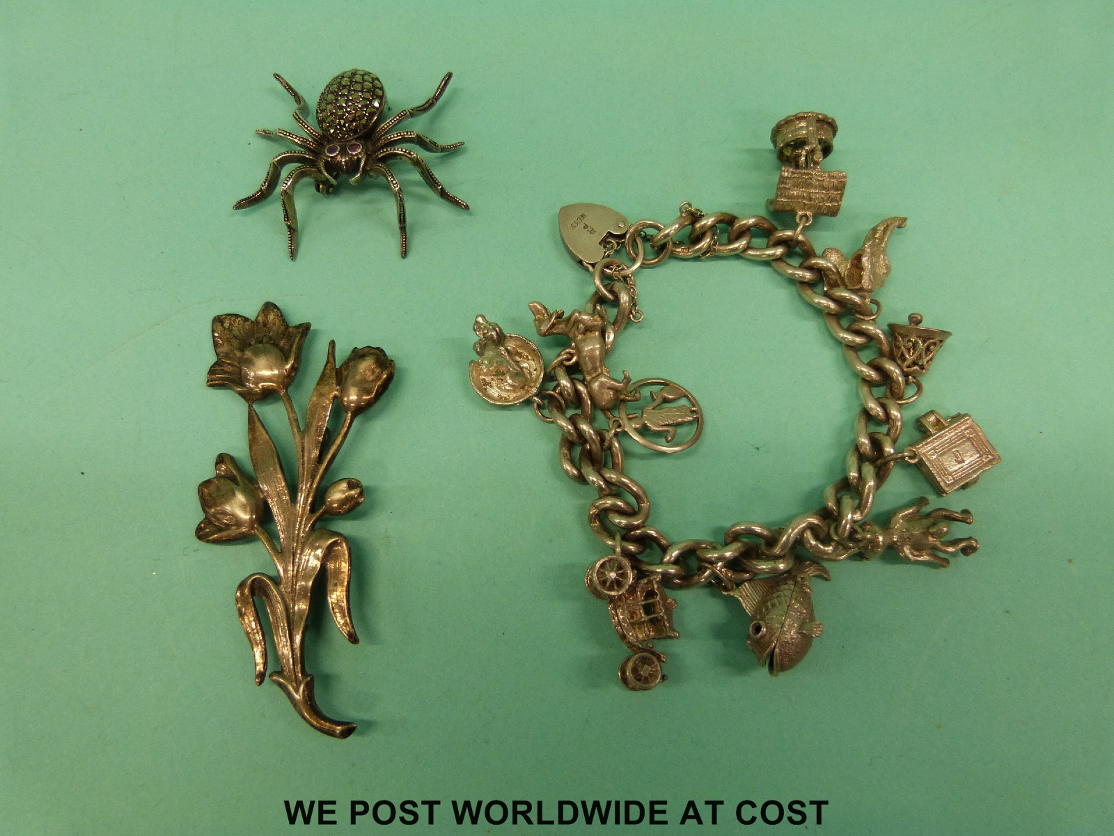 A silver brooch in the form of flowers,