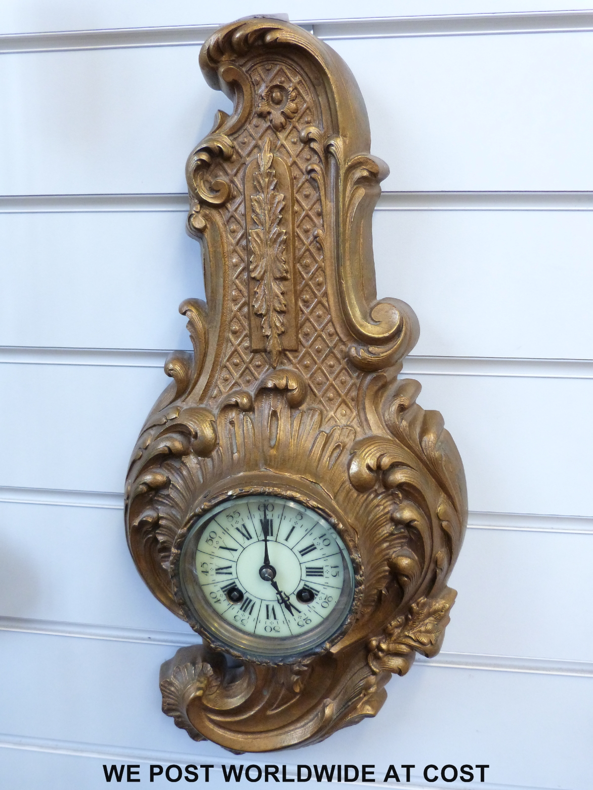 A French gilt metal wall clock in the piccolo style,