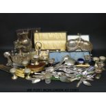 A quantity of silver plated items to include cased cutlery, egg set, jug,