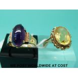 A 9ct gold ring set with an oval cut citrine (size P/Q) and a 9ct gold ring set with an amethyst