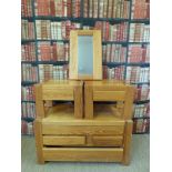 A pine chest of drawers and a matching pair of bedside tables