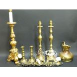 A collection of table lamps, horse brasses,