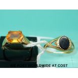 A 9ct gold ring set with a citrine (size M) and a 9ct gold ring set with onyx (size M)