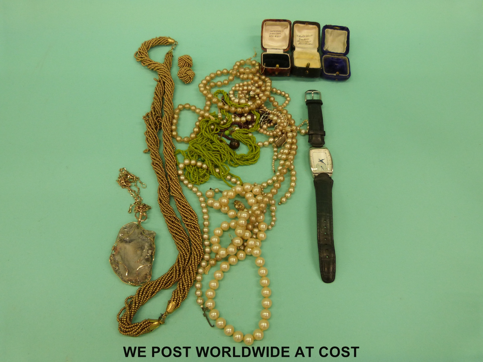 A quantity of costume jewellery including necklaces, Cross watch, jewellery boxes, quartz necklace,