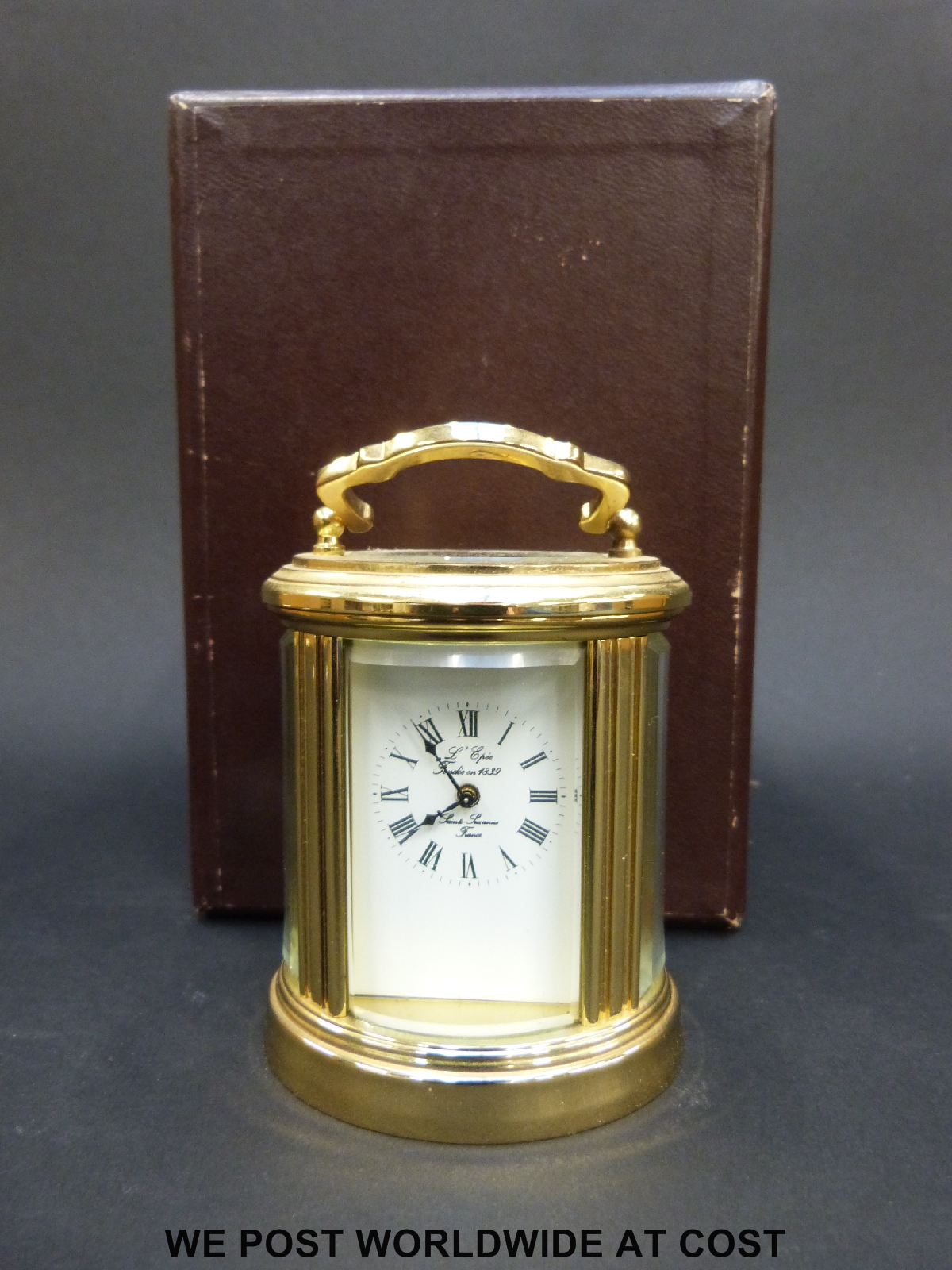 A L'Epee miniature French brass cased oval carriage clock in box, 7.