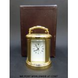 A L'Epee miniature French brass cased oval carriage clock in box, 7.