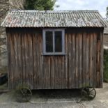 A vintage shepherd's hut with lockable door,