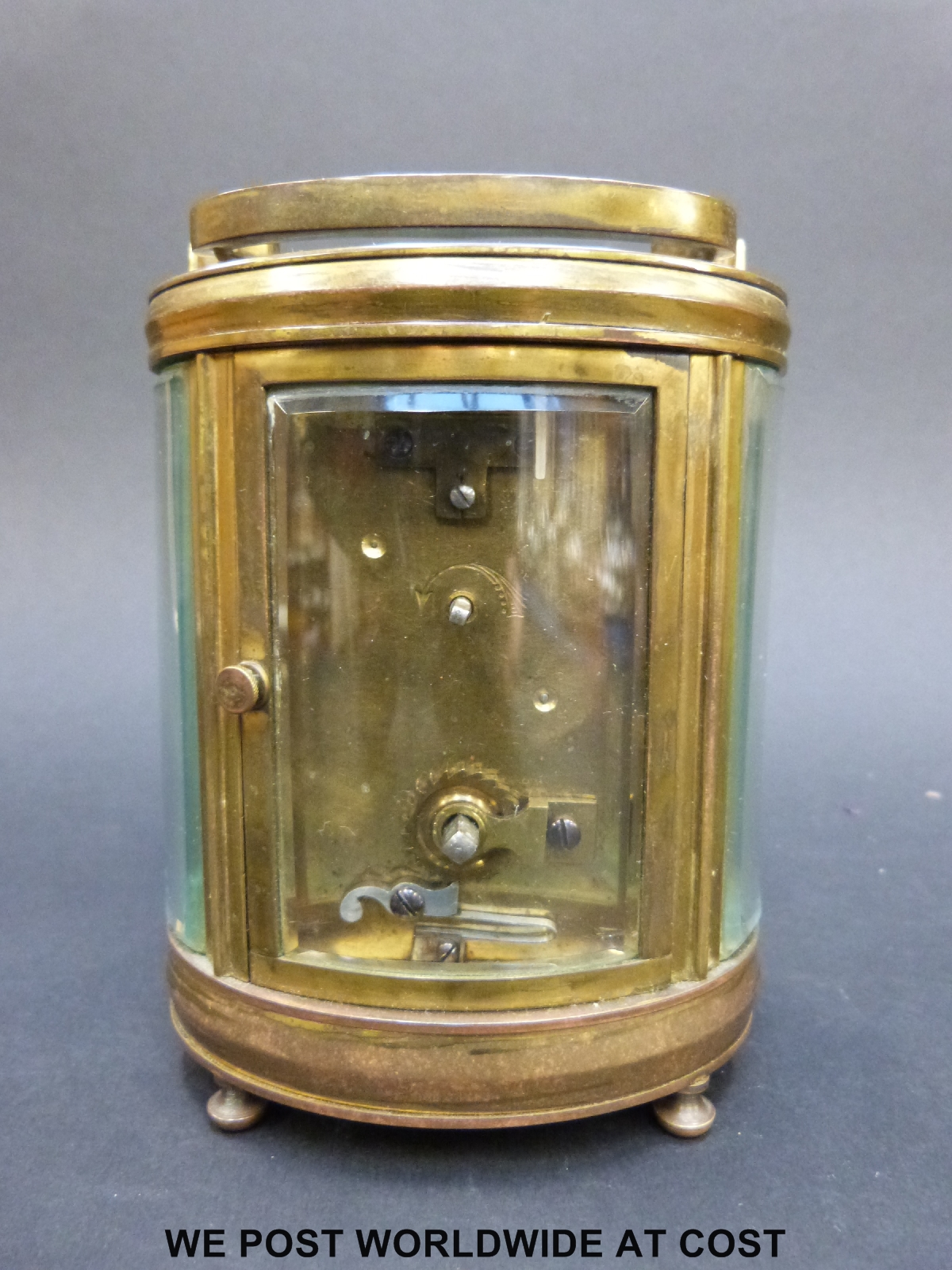 A mantel clock of oval section with bevelled glass and pierced gilt foliate panel to dial - Image 4 of 7
