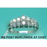 A 14ct white gold ring set with fourteen graduated diamonds (size M)