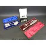 A quantity of cased plated cutlery comprising a pair of berry spoons,