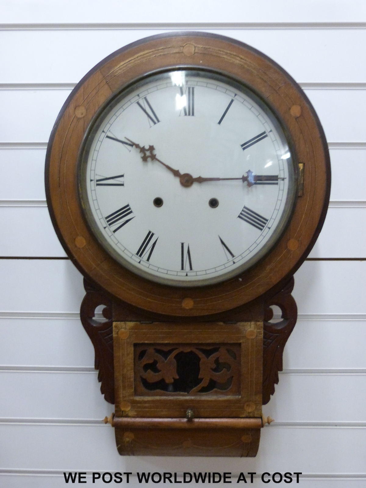 An American drop dial mid to late 19thC wall clock, the two train movement striking on a gong,