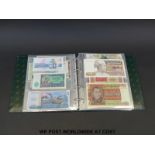 Approximately one hundred world banknotes in an album