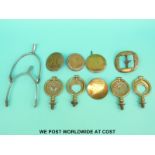 A collection of heavy/shire horse brass harness fittings and swing finials together with a pair of