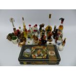 A collection of miniatures including a tin containing five bottles of Grants whiskey