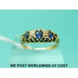 An 18ct gold ring set with sapphires and diamonds (size O)
