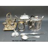 A quantity of plated ware including a six-place egg cruet with spoons,