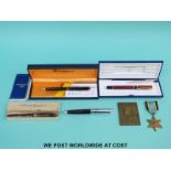 A Conway Stewart fountain pen with 14ct gold nib, a Sheaffer pen, two Waterman pens,