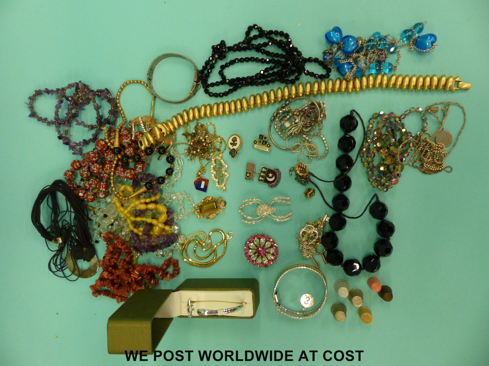 A quantity of costume jewellery to include ceramic beads, amethyst beads, sunstone necklace,