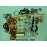 A quantity of costume jewellery to include ceramic beads, amethyst beads, sunstone necklace,