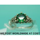 A white metal ring marked 18ct set with an emerald doublet with diamonds to the shoulders (size M)