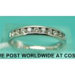 A platinum half eternity ring set with diamonds (size K/L)