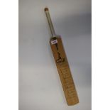 CRICKET: a miniature cricket bat bearing the full autographs of the Sussex and Australia cricket