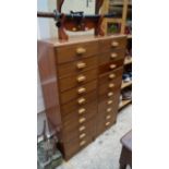 A pair of 20th century walnut ten drawer pillar chests, 41.5cm wide.