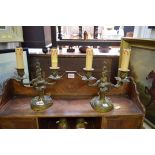 A pair of rococo style gilt brass twin branch candlesticks, 21cm high.