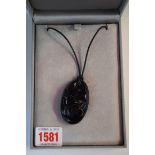 A Lalique black glass pendant, 5.5cm, in original box.