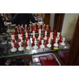 An antique Staunton pattern ivory chess set, red stained and natural, king 9cm high, pawn 4.