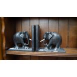 A pair of carved ebony elephant bookends, 18.5cm high.