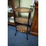 A Louis XV style walnut, yew wood and rosewood three tier etagere,