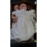 An Armand Marseille baby doll; together with a Heubach Koppelsdorf black baby doll;
