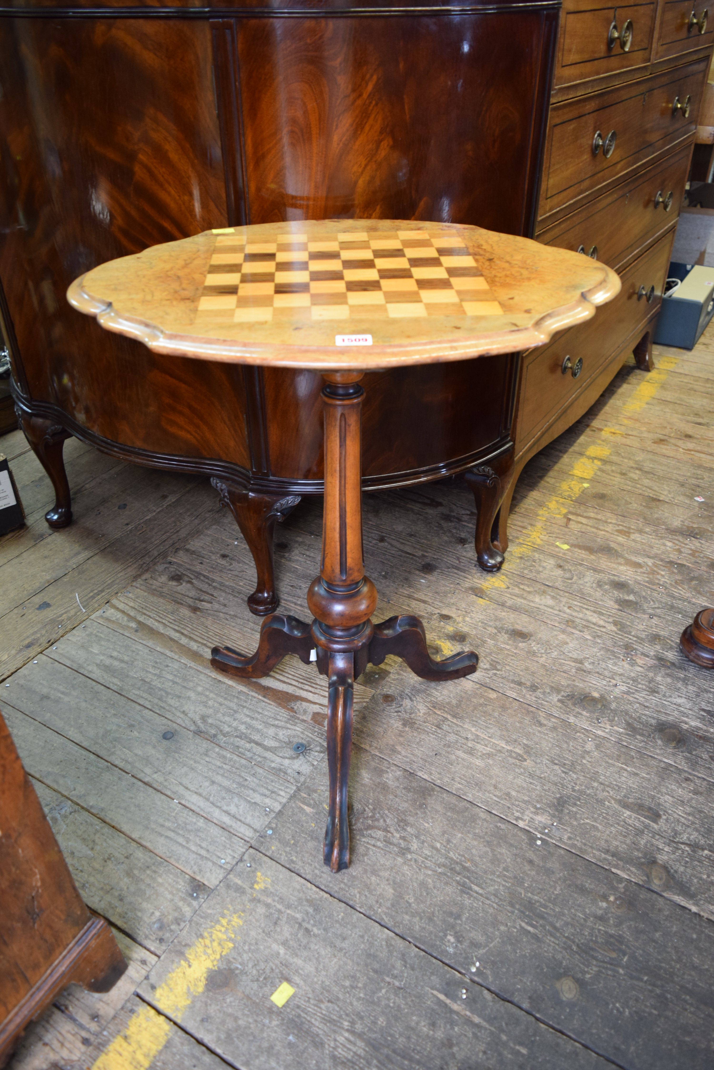 A Victorian walnut and chequerboard tripod occasional table, 59.5cm wide.