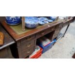 An old mahogany kneehole desk, 114cm wide.