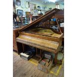 A Monington & Weston walnut baby grand piano, serial number 29668, length including keyboard 128cm.