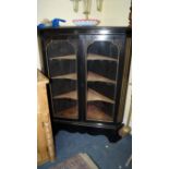 A late 19th century ebonized corner display cabinet, 130cm high x 97cm wide.