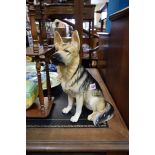 A Beswick fireside Alsatian, impressed No.2410, 35cm high.