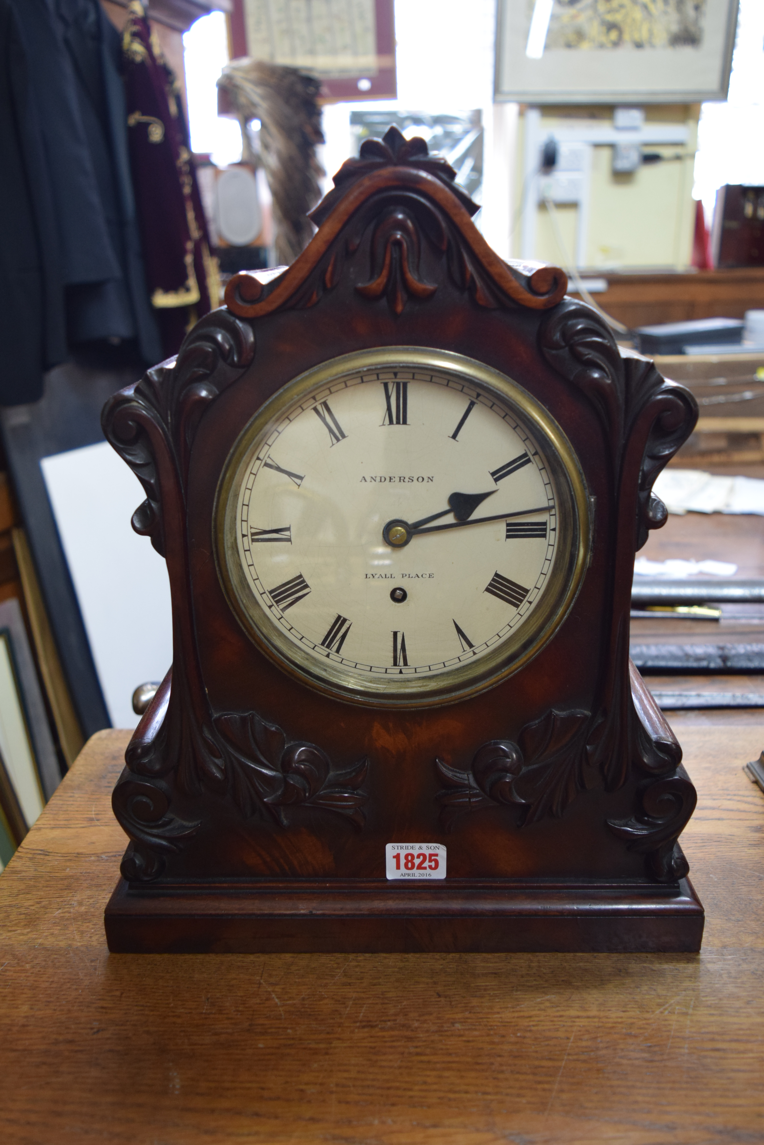 A Victorian mahogany bracket type clock, the painted circular dial inscribed 'Anderson,