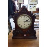 A Victorian mahogany bracket type clock, the painted circular dial inscribed 'Anderson,