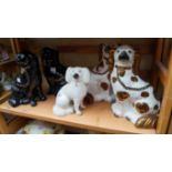 Two pairs of Victorian Staffordshire pottery spaniels; together with another similar poodle.