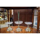 A good Victorian electroplated and engraved clear glass three piece table garniture,