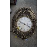 A French gilt wall clock.