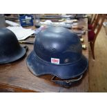 Two German WWII helmets, comprising Luftschutz; and a police example.