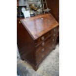 A George III mahogany and line inlaid bureau, 101.5cm wide.